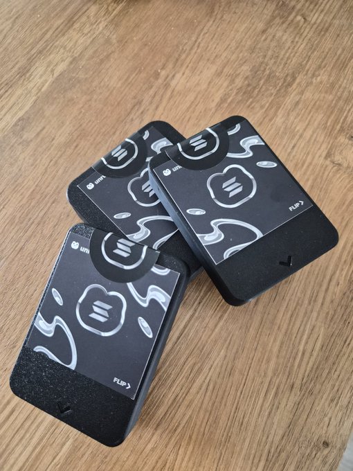 The image shows three black boxes with white designs, possibly containing information about a new product or service. The text "Guess who my next guest on Pirates Parley (powered by @triton_one)" suggests that these boxes are related to a social media platform called Twitter. The post also mentions the time of Wednesday at 3 pm UTC and hints at a possible promotional event for this platform.
