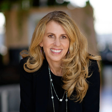Denelle Dixon, CEO of the Stellar Development Foundation, smiles in a professional headshot as she shares her perspective that tokenization is already widespread, regardless of the CLARITY Act.