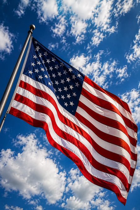 An American flag waves against a partly cloudy blue sky, symbolizing the U.S. market connection as Binance expands its wealth management offerings with 11 U.S.-listed ETFs for crypto users.