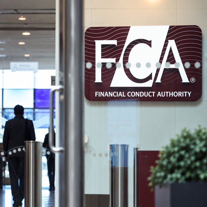 A person walks through the entrance of the Financial Conduct Authority's (FCA) office, where a prominent maroon and white FCA logo is displayed on a glass partition. The image relates to the post by visually establishing the FCA as the regulatory body issuing guidance on how crypto lending and borrowing activities, as well as information-only services, will be classified under its incoming crypto regime.