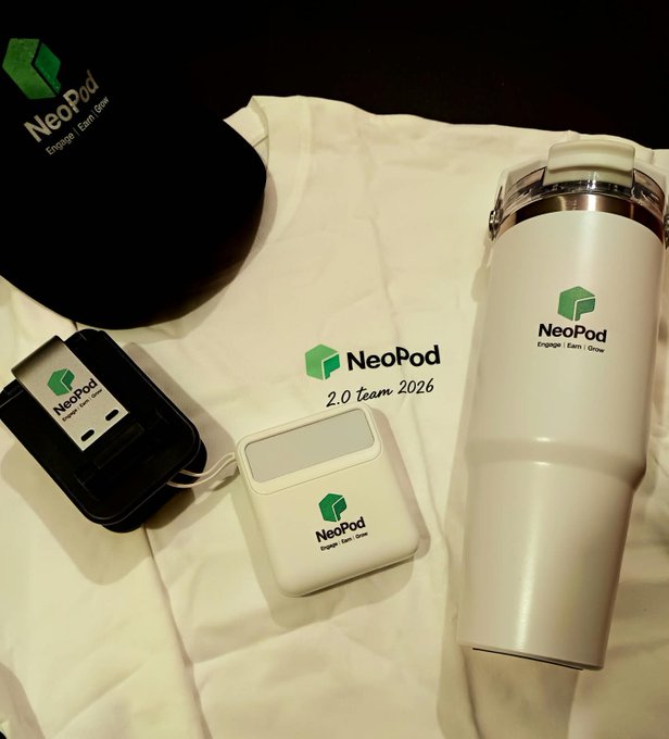 Branded merchandise on a white surface including a black cap, white t-shirt reading 'NeoPod 2.0 team 2026', AirPods case, small case, and white tumbler, all bearing the green 'NeoPod' logo with the tagline 'Engage | Earn | Grow'.