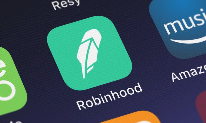 A close-up of a smartphone screen showing the green Robinhood app icon alongside an Amazon Music app icon.
