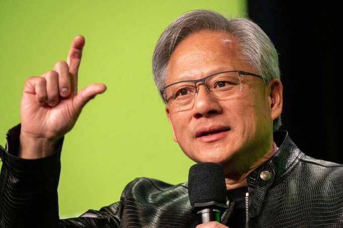The image features an older man wearing glasses, giving him a distinguished appearance as he speaks into a microphone. The background of the image is green, which contrasts with his gray hair and adds depth to the scene. The caption below the photo reads "Who wants to create a basket of these stocks and list on Solana? @jito_sol @MeteoraAG". This suggests that the man might be discussing stock trading or financial matters related to Bitcoin, as indicated by the green background and the presence of a microphone in his hand.