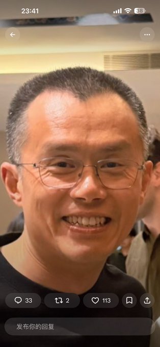 A smiling man with glasses and noticeable gray/white hair is shown in a close-up selfie-style photo, with a timestamp of 23:41 at the top. The image relates to the post's joke about the subject aging, as the visible gray hair and mature appearance support the comment about him "getting old."