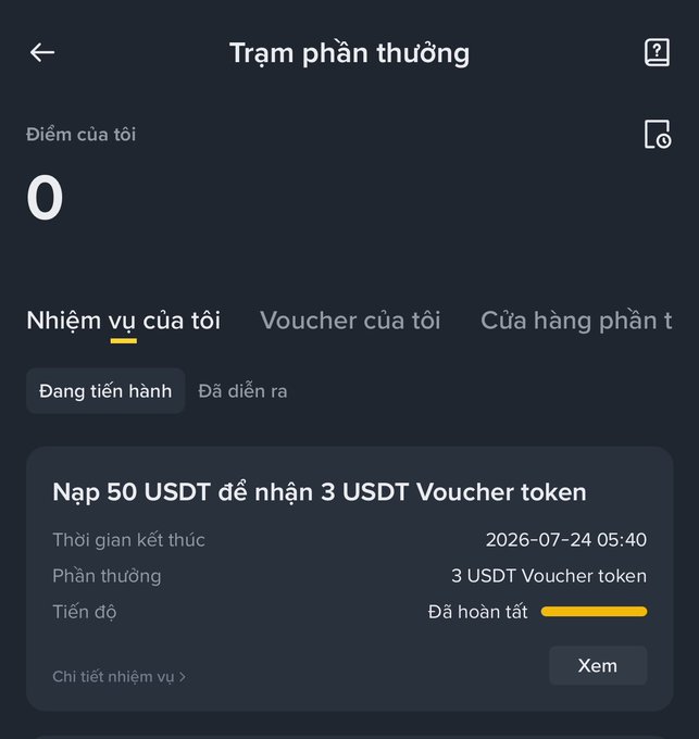 A Vietnamese rewards station screen titled 'Trạm phần thưởng' showing 0 points and a completed task to deposit 50 USDT to receive a 3 USDT voucher token, ending 2026-07-24.