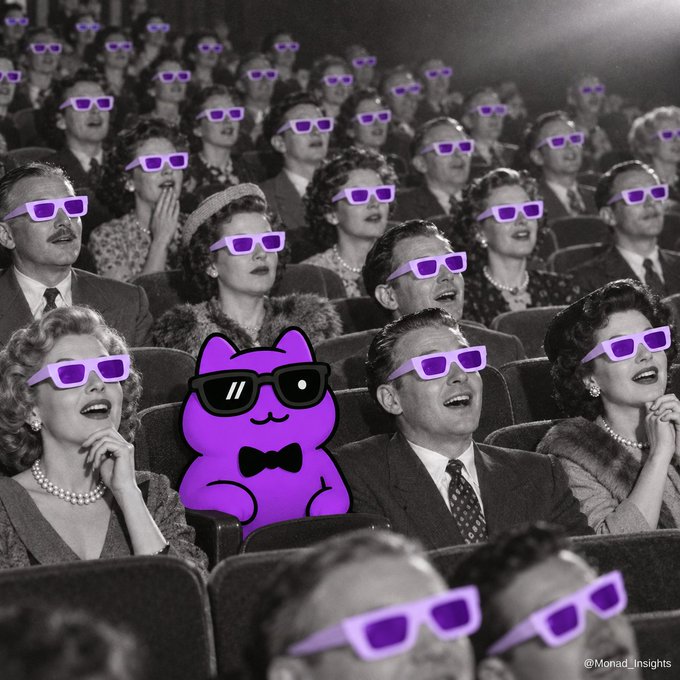 A black-and-white vintage photo of a movie theater audience watching a 3D film with anaglyph 3D glasses, overlaid with a purple cartoon cat wearing sunglasses and a bowtie, credited to @Monad_Insights.