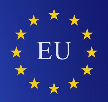 The European Union flag is displayed, featuring a circle of twelve yellow stars on a blue background with the letters "EU" in the center.