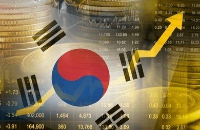 A graphic combining the South Korean flag (Taegeuk symbol) with an upward-pointing gold arrow, overlaid on stacks of coins and a stock market chart with numerical data.