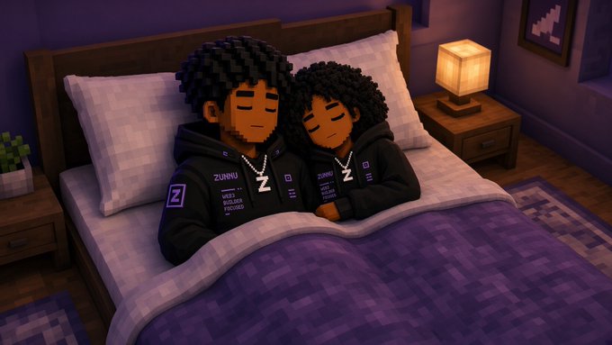 A pixel-art style 3D render of two blocky characters with curly hair sleeping peacefully in a bed, both wearing dark hoodies with a 'Z' logo and chains.
