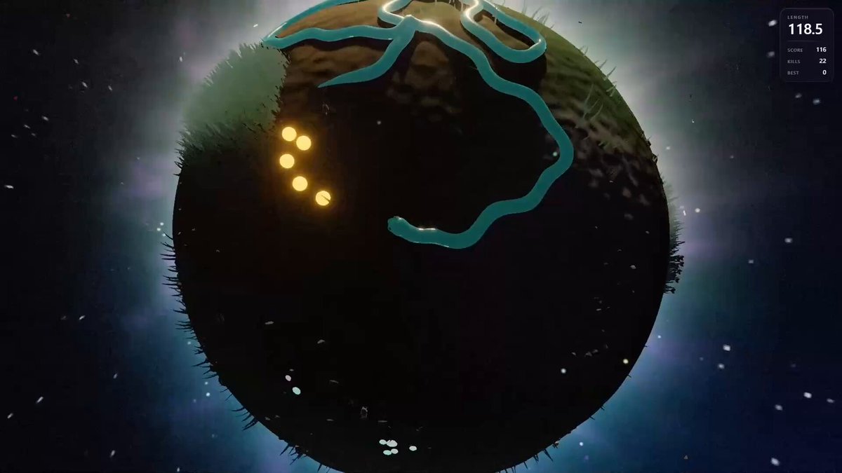 The image shows a planet with a green snake-like creature on its surface, which appears to be eating something. The background of the image is dark blue, suggesting that the planet might have an atmosphere or possibly a stormy weather system. The post reads "snek must eat", indicating that the player's objective in this game is to consume the green creature on the planet for sustenance.