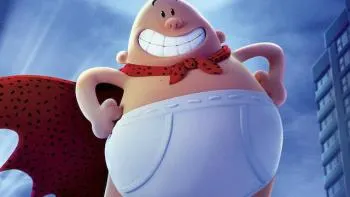 The image features a cartoon character, likely a man or a woman, wearing white underwear and standing against a blue sky with clouds. The character has a big smile on their face and appears to be posing for the photo. The caption "Here I am" is written in black text at the bottom of the image.