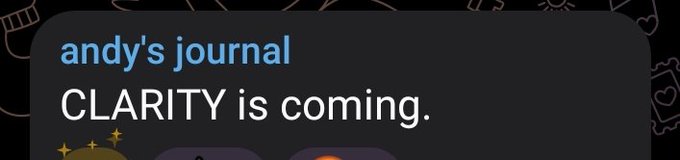 A cropped screenshot showing a dark-mode social media story or post header titled 'andy's journal' with the message 'CLARITY is coming.' displayed in white and blue text.