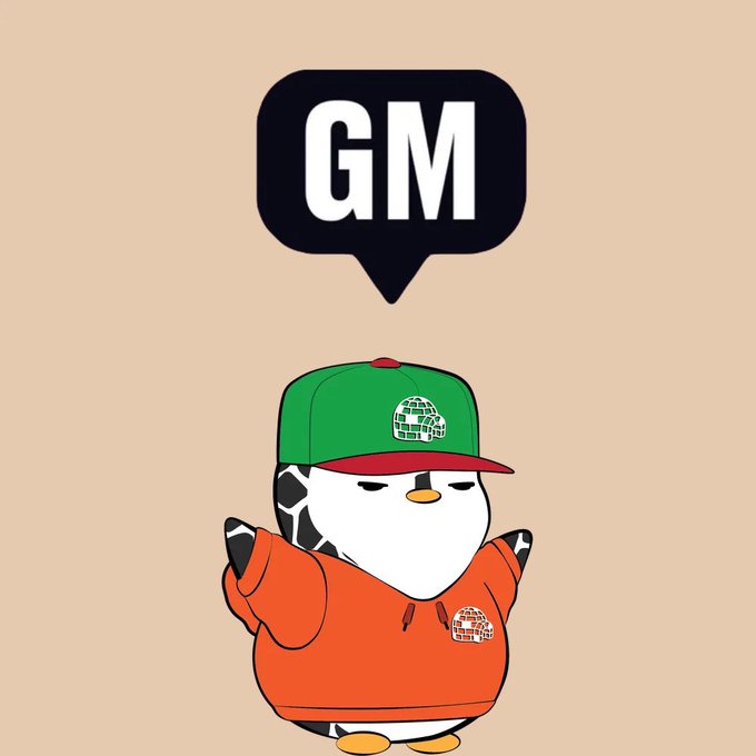 A cartoon penguin character wearing a green and red cap and orange hoodie with a 'GM' (Good Morning) speech bubble above it, set against a beige background.