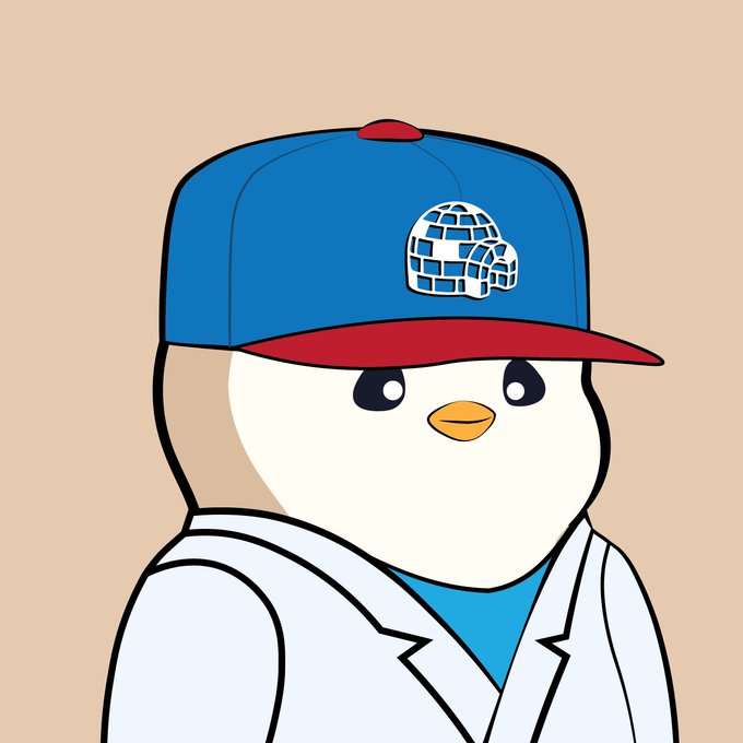 A cartoon penguin with large eyes wearing a blue and red cap with the same brick-patterned skull logo, dressed in a white coat over a blue shirt.
