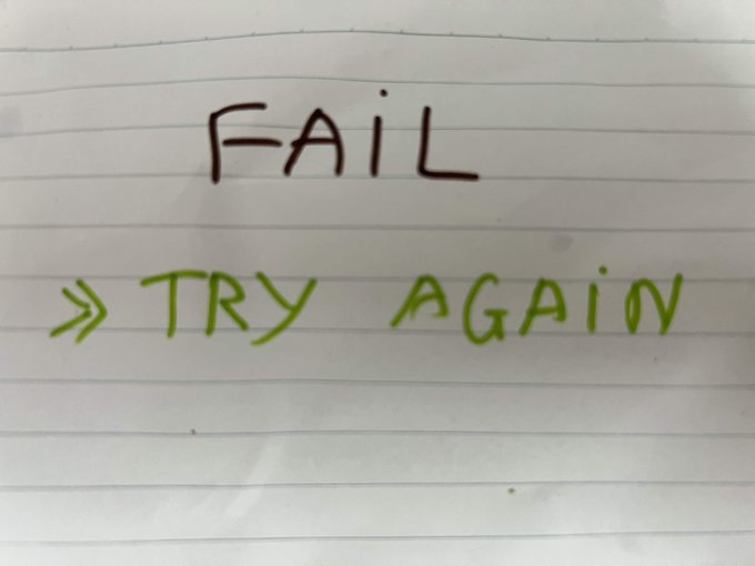 A handwritten note on lined paper reads 'FAIL' in black ink and '» TRY AGAIN' in green ink.