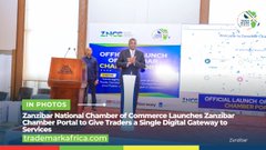 A news broadcast showing the Zanzibar National Chamber of Commerce launching a Zanzibar Chamber Portal for trade, with another scene of a woman working at a desk with Vietnamese text overlay.