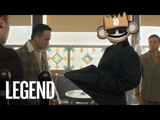 Meme image showing a scene from 'Forrest Gump' with one character's face replaced by a Bored Ape wearing sunglasses and a Bitcoin crown, labeled 'LEGEND'.