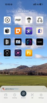A smartphone home screen screenshot showing the time 13:52 with various app icons including Google, POP, and others, with a scenic mountain landscape wallpaper and a bottom navigation bar.