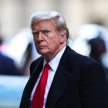 The image features a man with distinctive blonde hair, wearing a black suit, white shirt, and red tie, walking outdoors. This appears to be Donald Trump, the U.S. President referenced in the post, which discusses his surprising proposal to provide "$5,000" payments to approximately 240 million adult U.S. citizens if Republicans maintain control of both houses in the midterm elections.