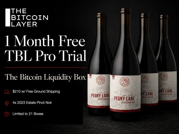 An advertisement for 'The Bitcoin Layer' offers a '1 Month Free TBL Pro Trial' featuring 'The Bitcoin Liquidity Box' with four bottles of Peony Lane Estate Pinot Noir for $210, limited to 21 boxes.