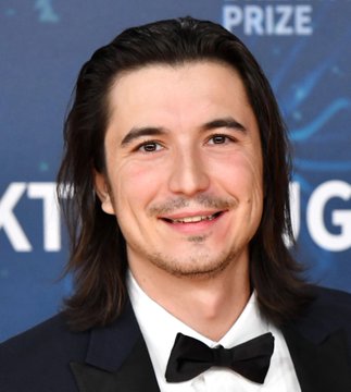 Robinhood CEO Vlad Tenev smiles as he announces "Robinhood summer is here," in this image. The accompanying text and his statement suggest optimism for the company.