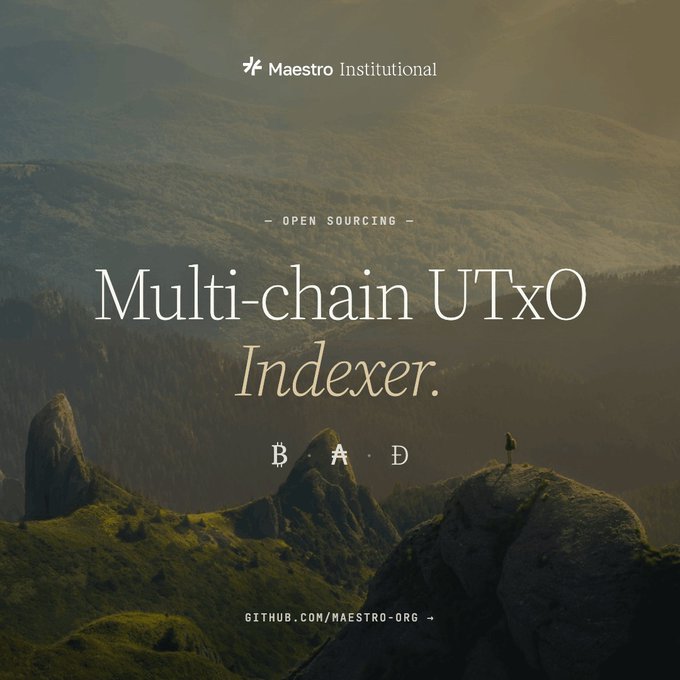 A promotional graphic by Maestro Institutional announcing the open-sourcing of their "Multi-chain UTxO Indexer," displayed against a misty mountain landscape with a lone figure standing on a rocky peak. The tagline "B · A · D" appears below the headline, with the GitHub link "GITHUB.COM/MAESTRO-ORG" at the bottom, reinforcing the post's message about releasing production-grade Cardano infrastructure to the public.