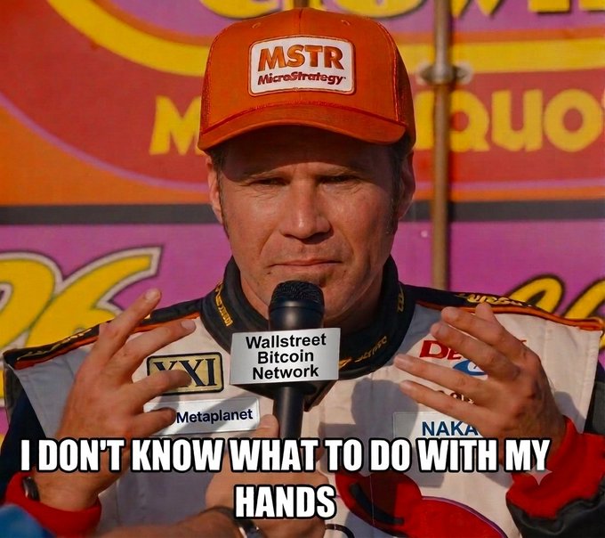 A meme image of a race car driver wearing an 'MSTR MicroStrategy' hat at a Wallstreet Bitcoin Network event, captioned 'I DON'T KNOW WHAT TO DO WITH MY HANDS'.