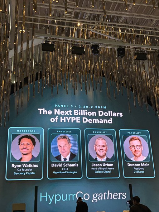 A large event screen displays "Panel 3 - 2:20-2:50PM: The Next Billion Dollars of HYPE Demand," featuring moderator Ryan Watkins (Syncracy Capital) and panelists David Schamis (Hyperliquid Strategies), Jason Urban (Galaxy Digital), and Duncan Moir (21Shares), with "HypurrCo gathers" branding below. The setup ties directly to the post's praise of the well-executed HypurrCo-organized Hyperliquid event.