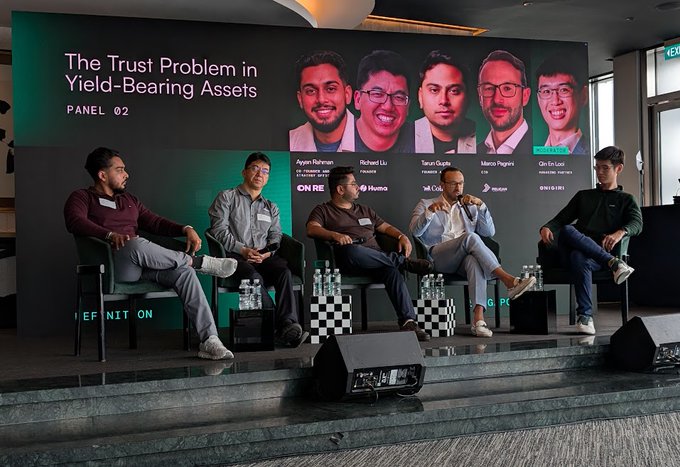 Panel discussion titled 'The Trust Problem in Yield-Bearing Assets' featuring speakers Aryan Rahman, Richard Liu, Tarun Gupta, Marco Pagani, and Chi-En Lo from companies including OnRe, Huoma, and Ones Global.