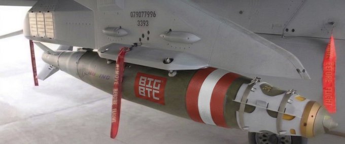 A military jet (tail number 079077996) is shown carrying an unguided bomb that has been humorously redecorated with red and white stripes and a "BIG BTC" label, fittingly tying into the "From BIG BTC with love" post by visually weaponizing the Bitcoin ticker as a playful nod to crypto enthusiasm.
