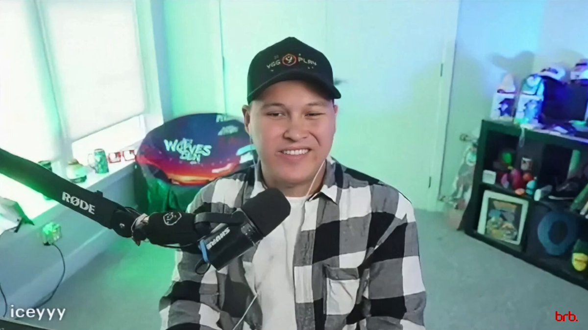 In this image, there's an older man wearing a black hat sitting behind a microphone at a desk with a green wall as his backdrop. He appears to be smiling while talking into the microphone, which suggests that he might be hosting or participating in a radio show or podcast. The image also contains text that reads "Icey gives Nirvy and YGG Queue Up the timeless advice of providing value" and "The people that follow you, they clicked follow for a reason, they clicked". These phrases seem to be related to the content being discussed on the radio show or podcast, possibly discussing the importance of adding value in various aspects of life.