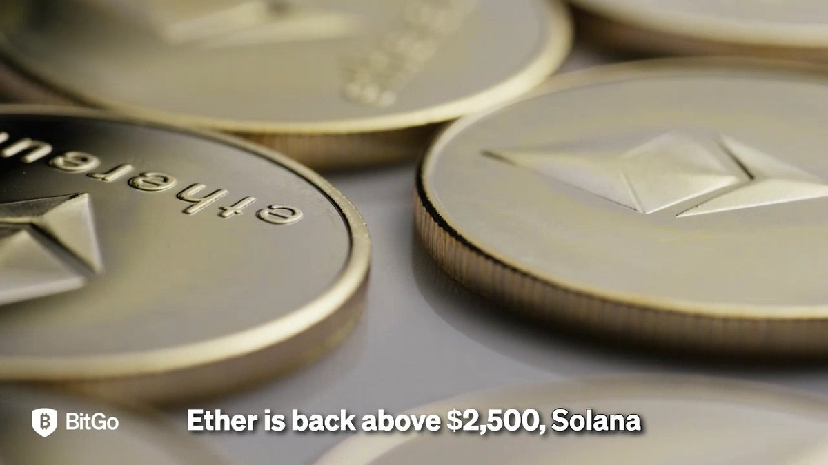 A close-up photograph shows several physical gold and silver Ethereum cryptocurrency coins resting on a surface, with a BitGo logo and partial text reading 'Ether is back above $2,500, Solana' at the bottom.