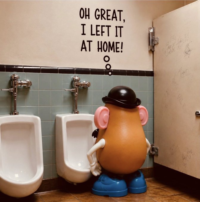 An image of Mr. Potato Head in a men's restroom looking at a urinal with text reading 'OH GREAT, I LEFT IT AT HOME!'