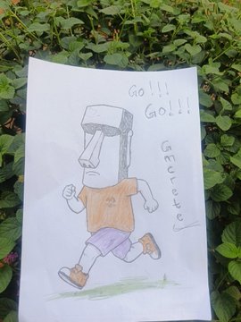 A child's hand-drawn colored sketch on paper shows a person with a box-like head running, with the text 'GO!!! GO!!!' and the name 'Keitongo' written on it.