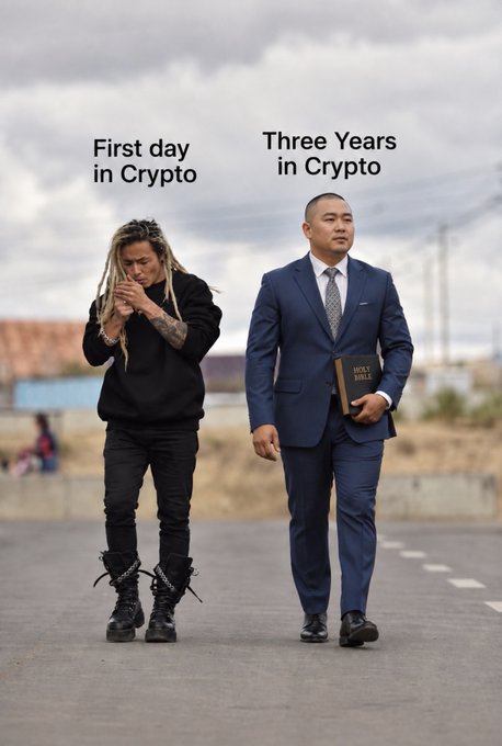 A meme showing two men walking with labels 'First day in Crypto' (a disheveled man in black) and 'Three Years in Crypto' (a man in a blue suit holding a Holy Bible).