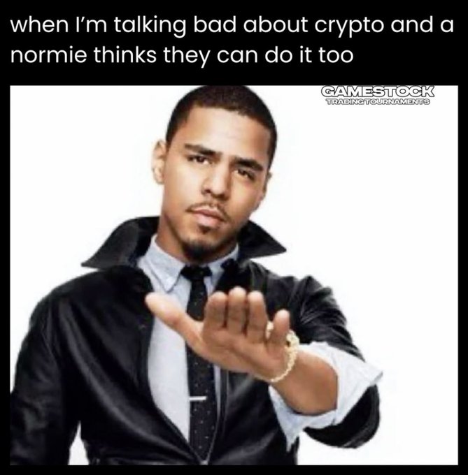A meme featuring Juelz Santana making a 'talk to the hand' gesture with the caption 'when I'm talking bad about crypto and a normie thinks they can do it too,' with a 'GAMESTOCK TRADINGTOURNAMENT' watermark.