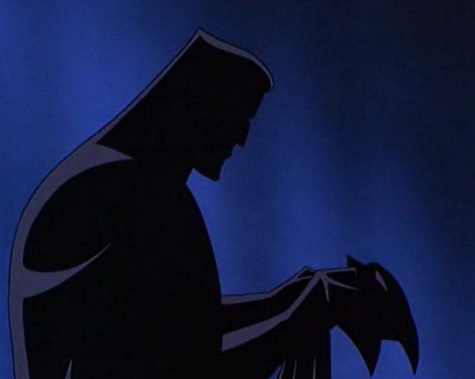 An animated silhouette of Jesus holding a small lamb against a deep blue background.