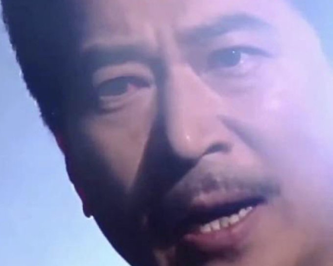 A close-up shot of actor Nam Doohwan from the Korean drama "The King: Eternal Monarch," showing his face with a determined expression that reflects the encouraging message urging him to rise and take pride as a figure of Joseon. The image captures his intense gaze and slightly parted lips, visually reinforcing the post's rallying sentiment.