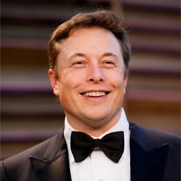 A portrait of Elon Musk smiling, wearing a black tuxedo with a bow tie.
