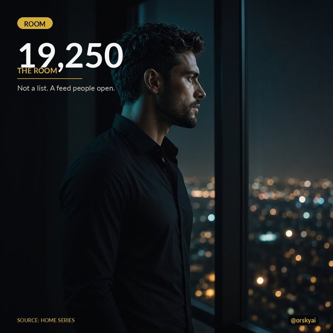 An advertisement or social media graphic showing a man in a black shirt looking out a window at a city at night, with text reading 'ROOM 19,250', 'THE ROOM', 'Not a list. A Feed people open.', 'SOURCE: HOME SERIES', and '@orskyai'.