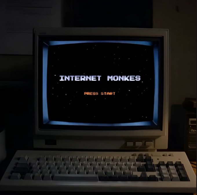 The image shows an old CRT monitor displaying the title "INTERNET MONKES" with "PRESS START" in orange below it, stylized like a retro video game screen. This ties into the post celebrating the user's mint of 5,000 "Internet Monkes" NFTs on Robinhood, which has already tripled in value.