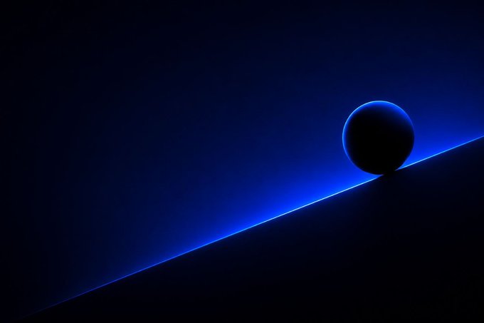 A minimalist digital artwork features a dark sphere with a blue glowing edge, partially obscured by a diagonal dark line against a deep blue background.