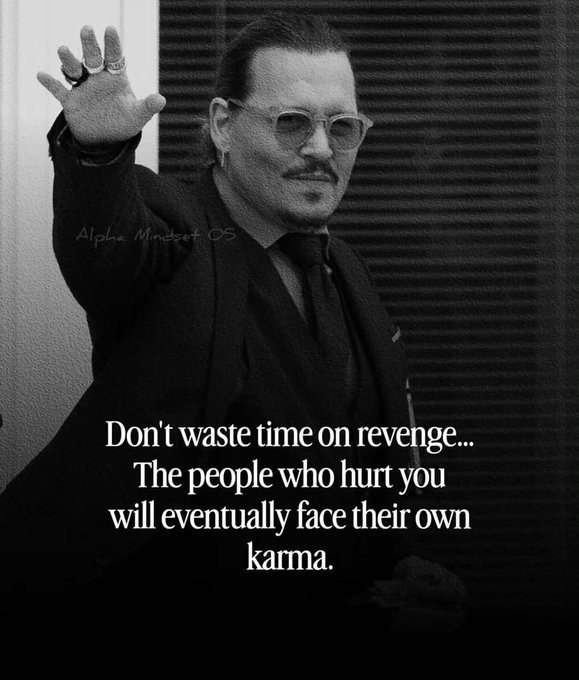 A black and white image of a man in a suit and sunglasses with his hand raised, overlaid with the quote 'Don't waste time on revenge... The people who hurt you will eventually face their own karma.' and a watermark 'Alpha Mindset 05'.