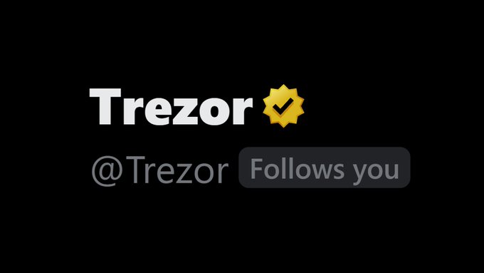 A Trezor account profile header displays the username @Trezor with a yellow verified checkmark badge and a 'Follows you' button.