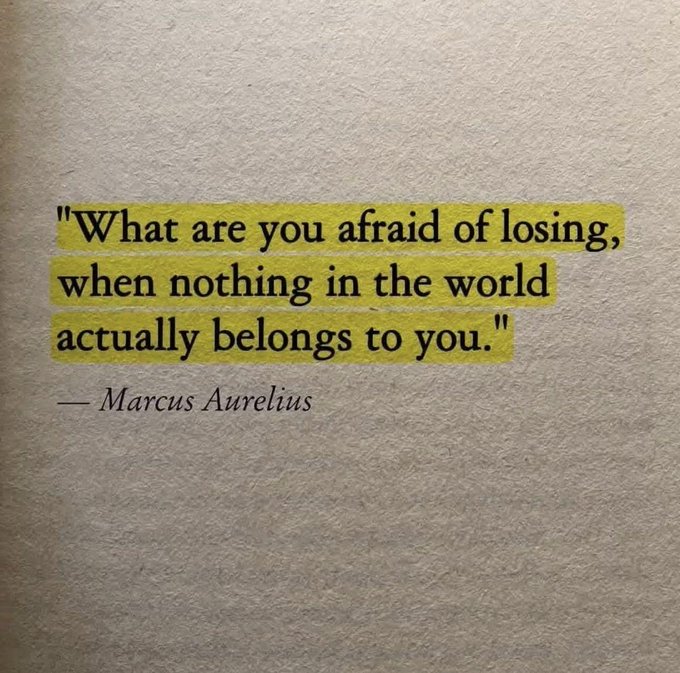 A highlighted quote on a book page reads, "What are you afraid of losing, when nothing in the world actually belongs to you." — Marcus Aurelius, paired with a post pondering fear of loss.