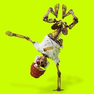 A skeletal robot figure in white clothing and a backwards cap performs a handstand breakdance move against a bright green background.
