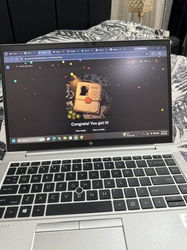A person shows off their newly minted "Crew Talented Detective Ying profile #8" NFT on a webpage displayed on an HP laptop, celebrating their latest acquisition of 4 Spies from @SpyIncGame, an NFT-based strategy game on Robinhood where they'll manage their agency and send spies on missions every 12 hours.