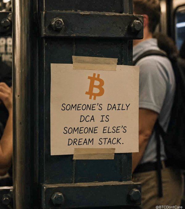A flyer taped to a metal subway pole features the Bitcoin logo and reads 'SOMEONE'S DAILY DCA IS SOMEONE ELSE'S DREAM STACK,' with a man wearing a backpack visible in the background.
