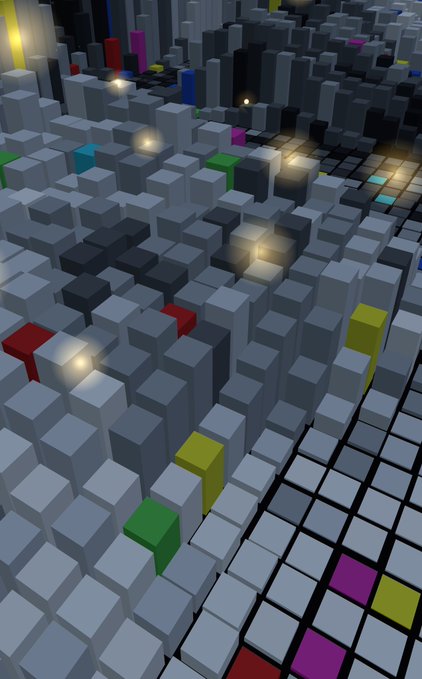 A 3D-rendered cityscape made of gray cubic blocks at varying heights, dotted with colorful accent blocks in green, yellow, red, and purple, with scattered glowing light sources.