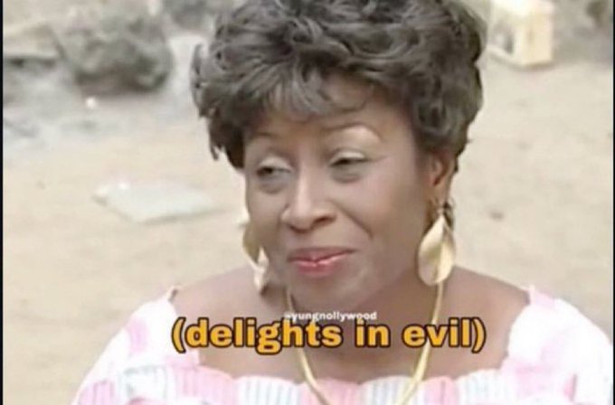 A screenshot of a Nollywood scene featuring a woman with the caption '(delights in evil)' and a 'naijnollywood' watermark.